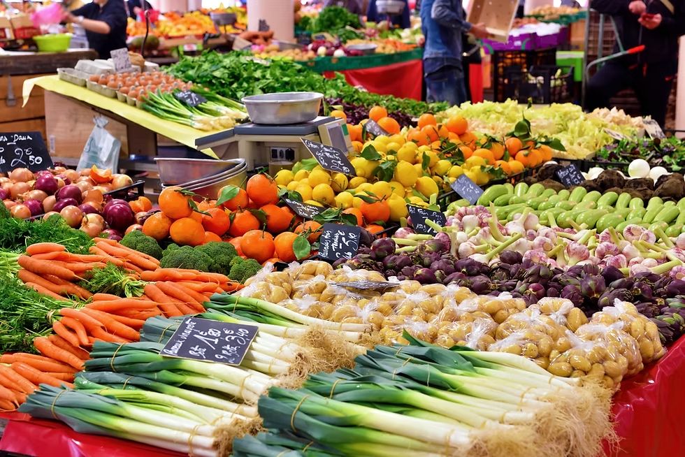 Fresh produce displayed by vendors at Broad Street Market